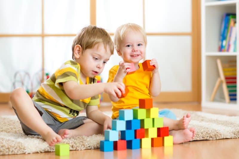 online-furniture-store-preschooler-children-playing-with-colorful-toy-blocks-min
