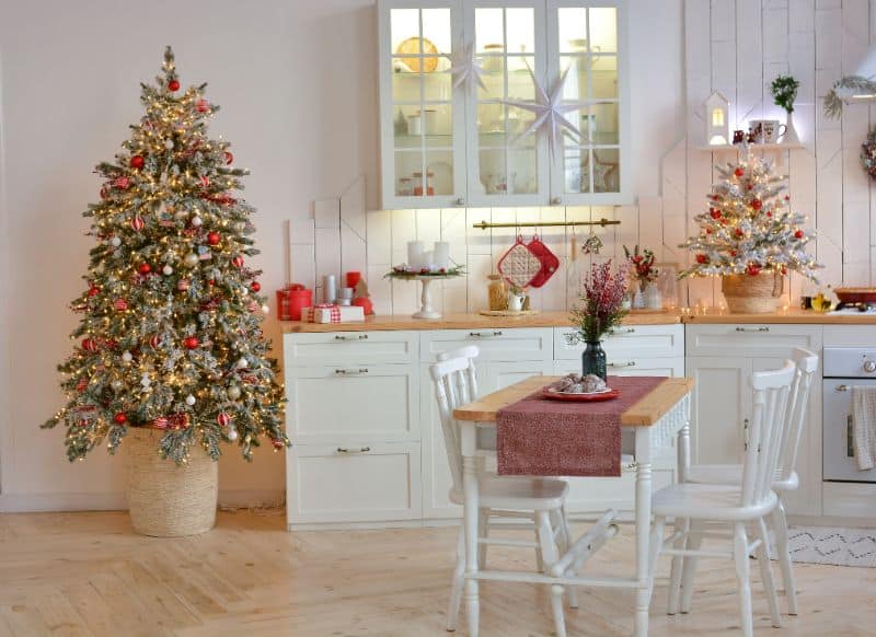 interior-of-a-light-white-shristmas-kitchen-with-red-decor-elements-in-the-scandinavian-style-christmas-decorations-breakfast-234101216-min