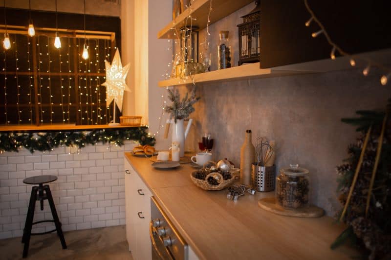 new-years-kitchen-interior-christmas-wreath-hanging-on-the-kitchen-wall-new-years-decor-of-kitchen-168027146-min