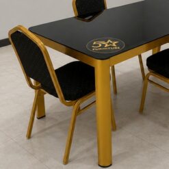 Black table top and gold legs-close-up